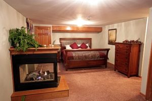 the cozy bed in the Eagles suite